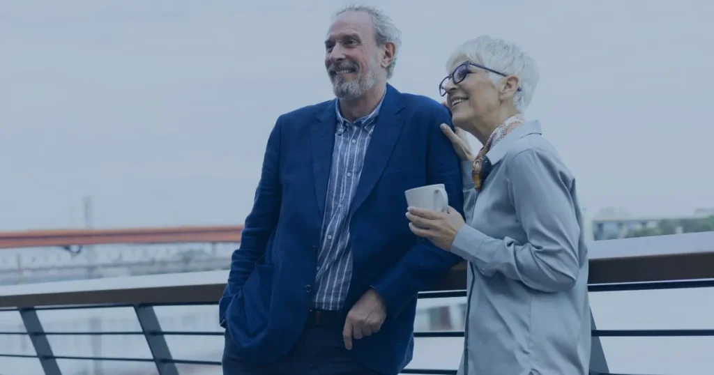 Retirement planning couple relaxing on balcony